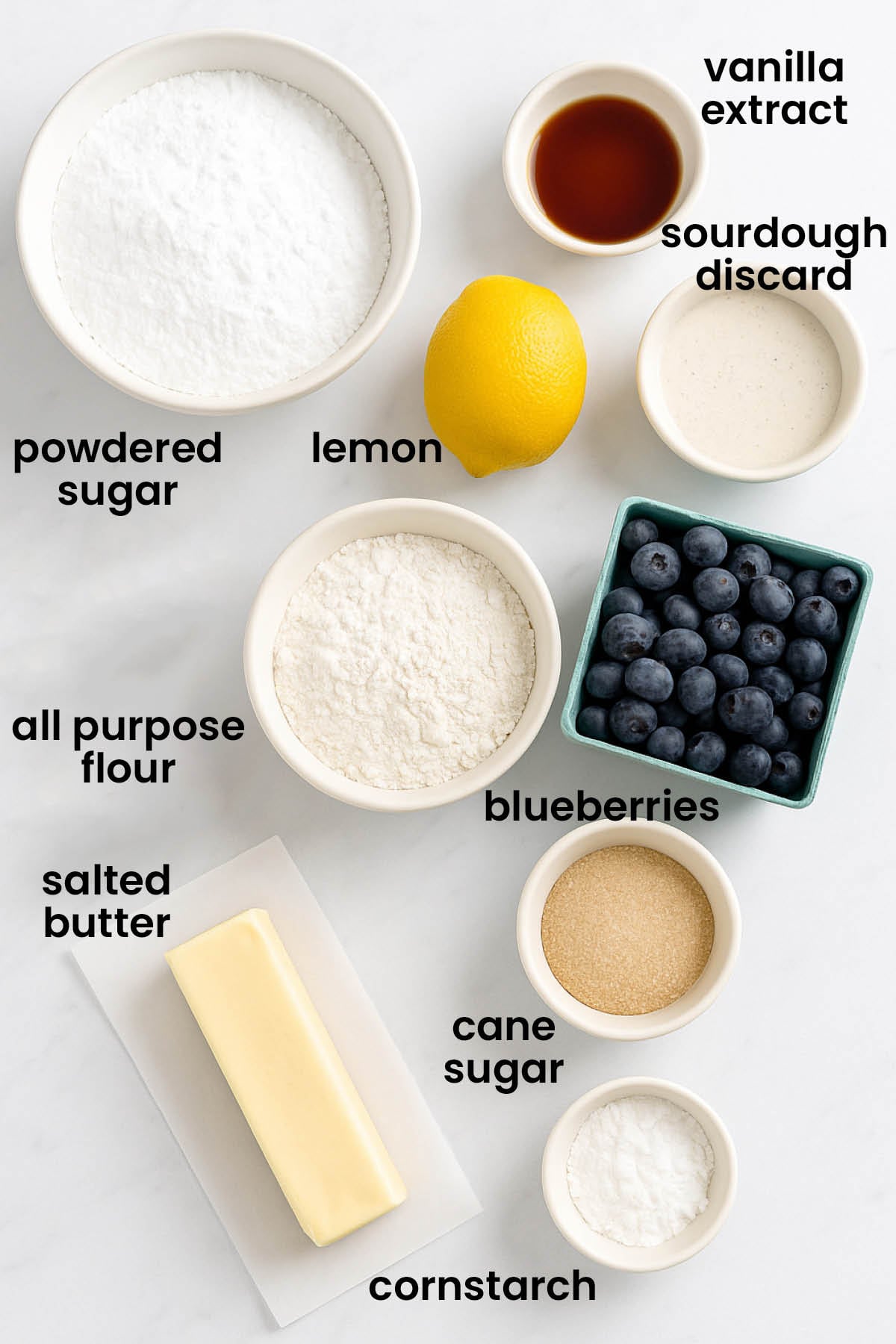 individual ingredients for sourdough blueberry crumb bars laid out against a white background.