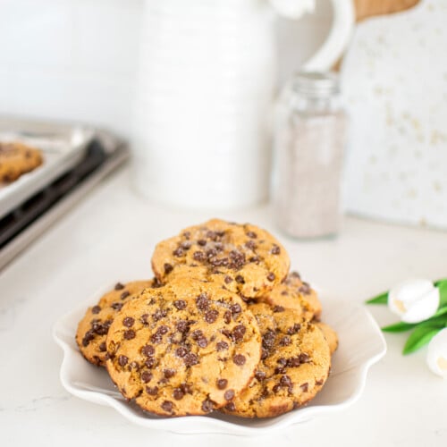 plate of vanilla sea salt chocolate chip cookies on a white marble kitchen counter.