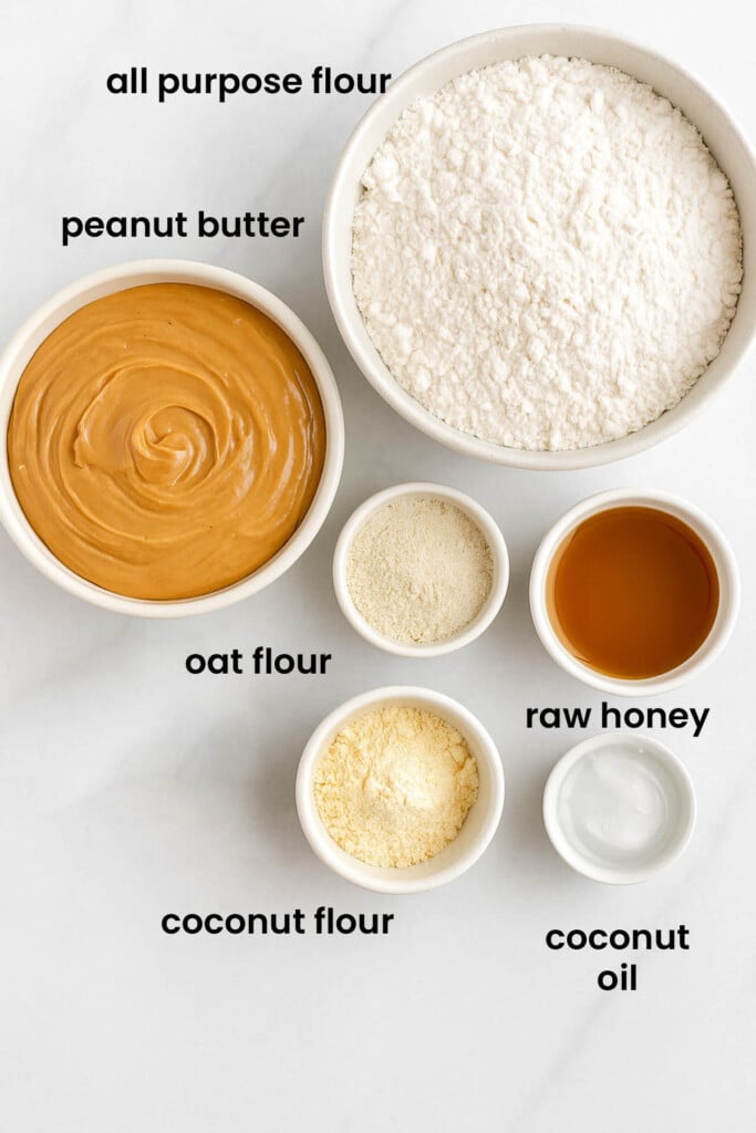 individual ingredients for mushroom peanut butter dog treats laid out against a white background.