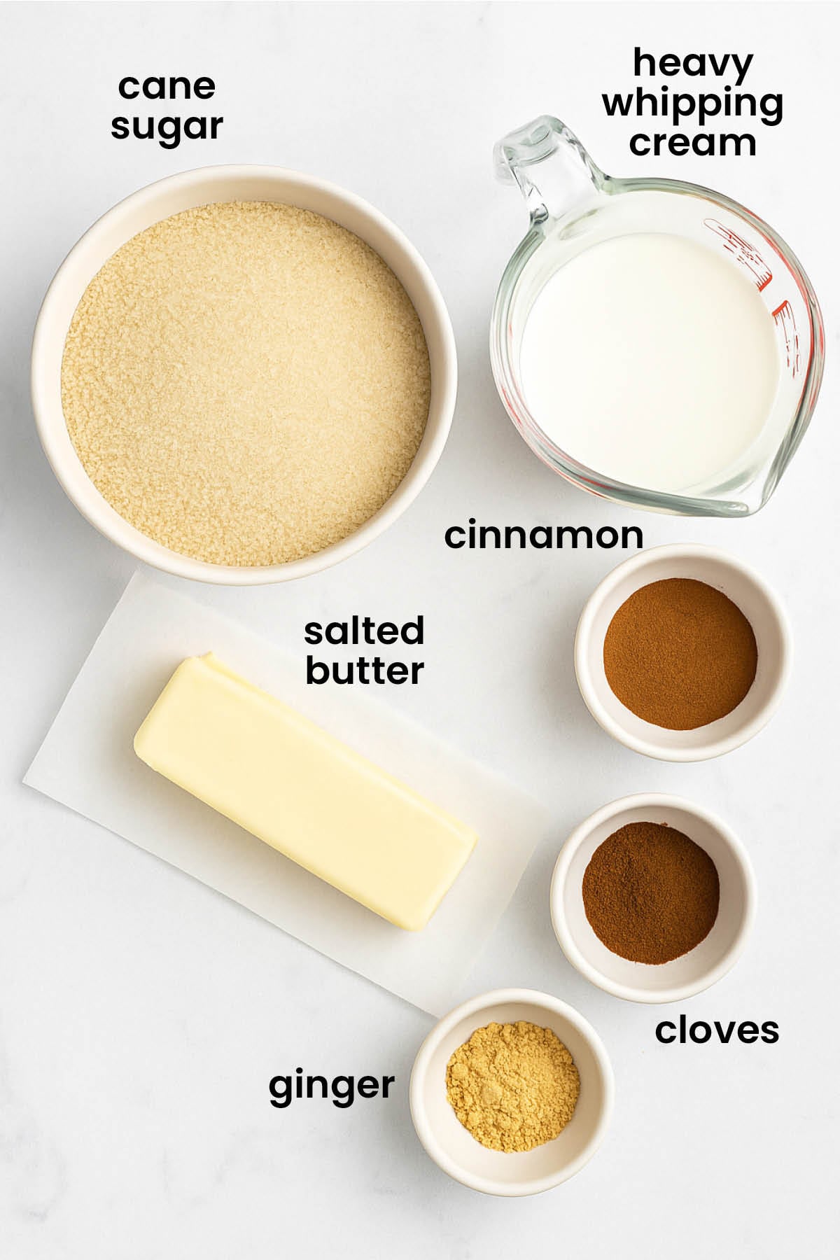 individual ingredients for gingerbread caramel sauce laid out against a white background.