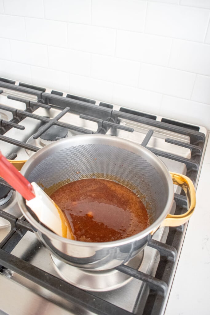 melted cane sugar in a titanium pot on the stovetop.