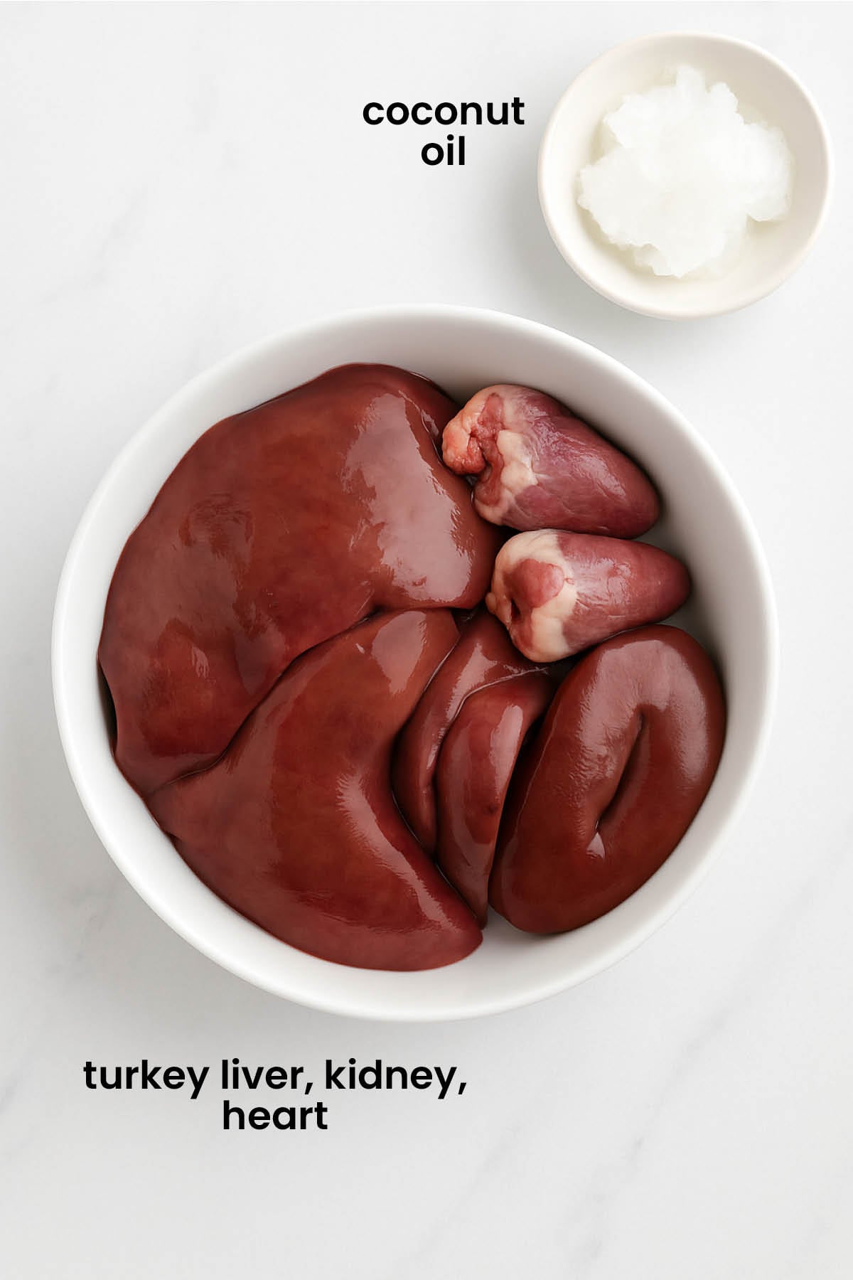 individual ingredients for turkey giblets for dogs laid out against a white background.