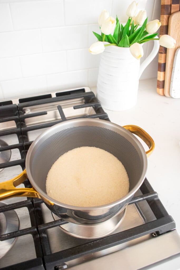 cane sugar in a pot on a stovetop.