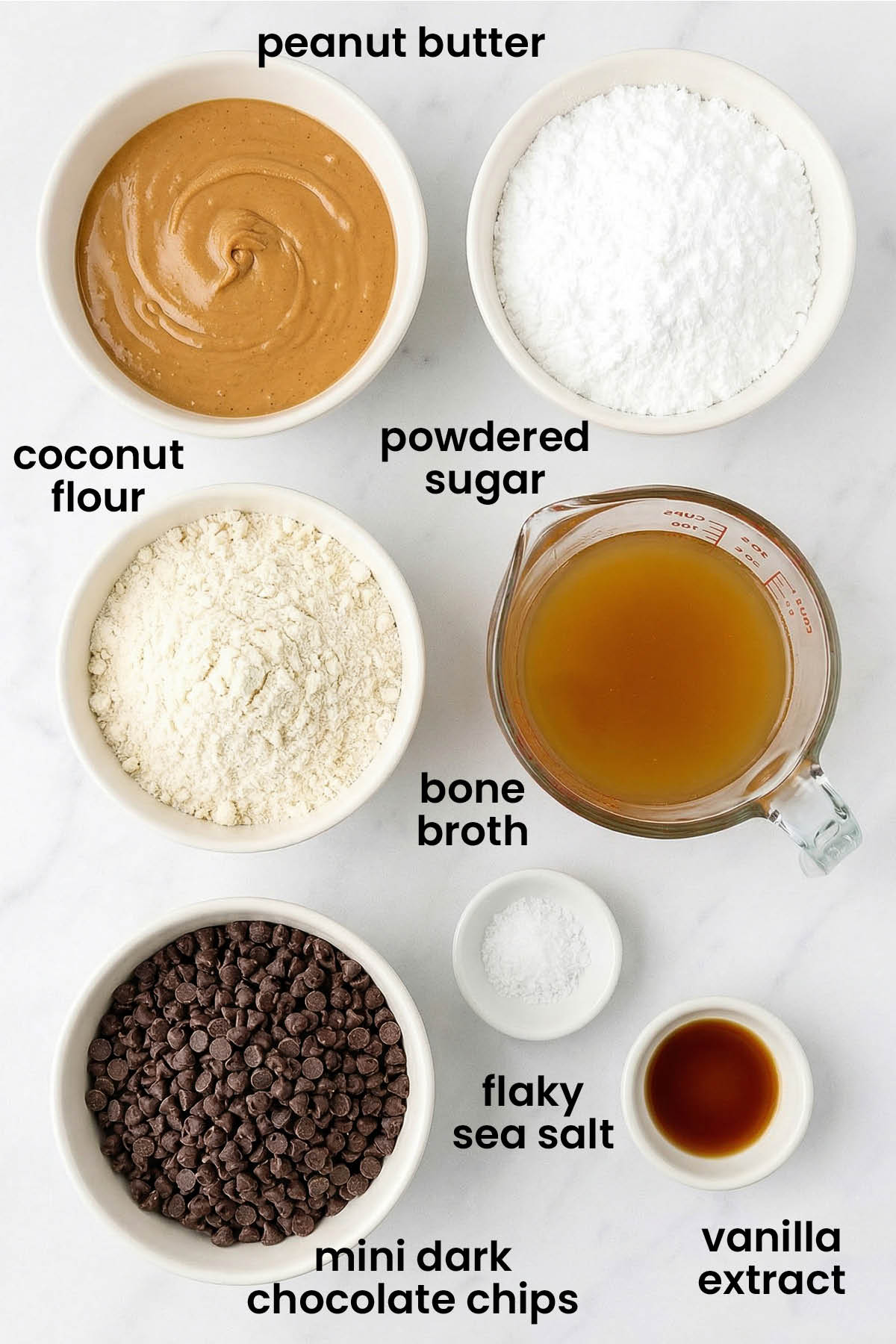 individual ingredients for chocolate peanut butter eggs with bone broth laid out against a white background.