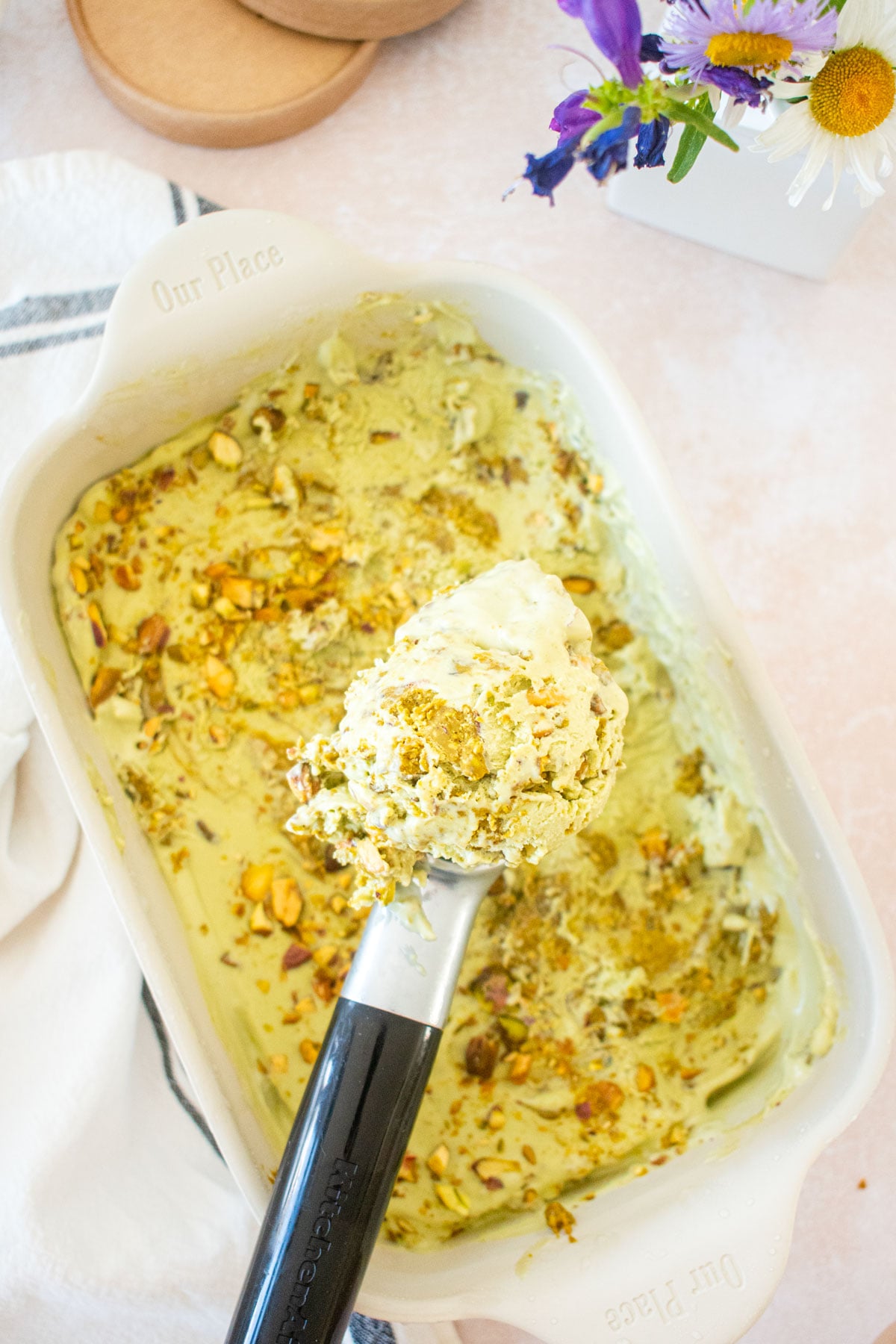 pistachio matcha no churn ice cream being scooped with an ice creams coop.