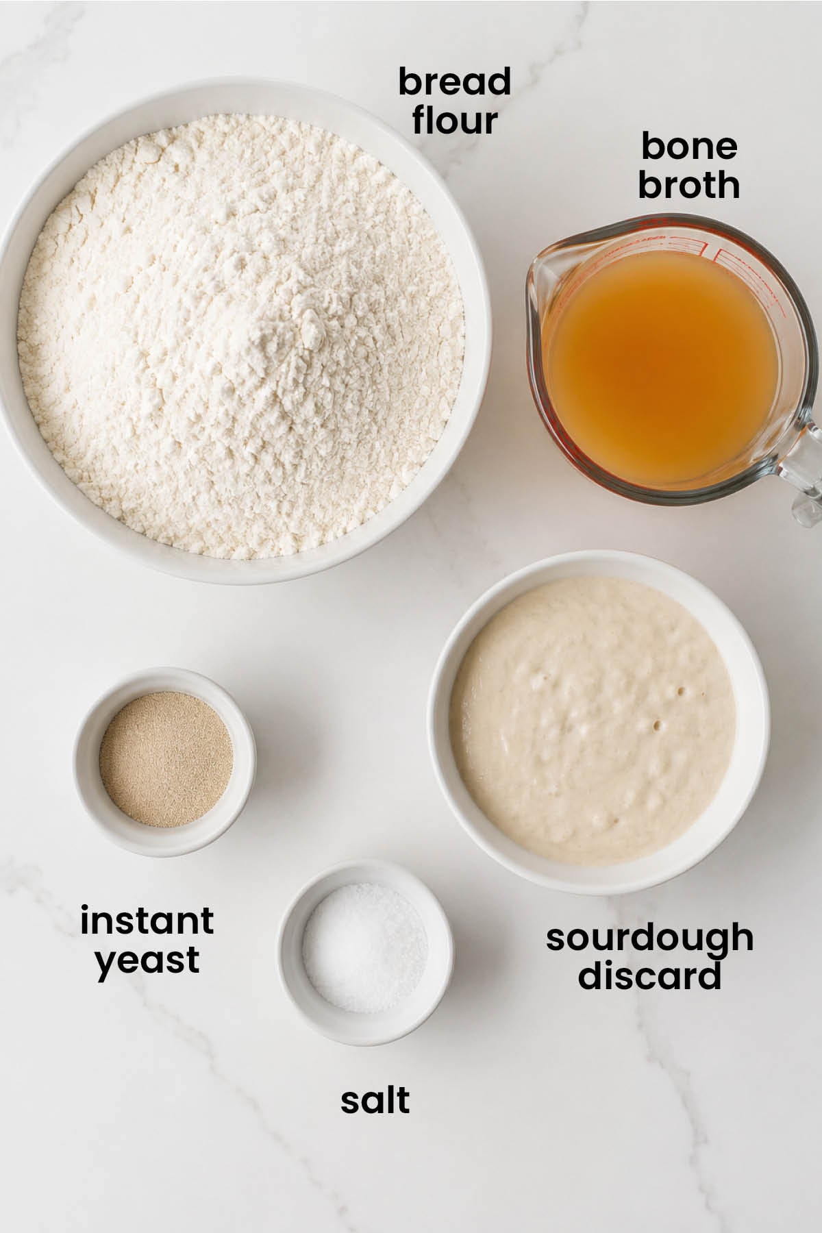 individual ingredients for sourdough discard bread with bone broth out against a white background.